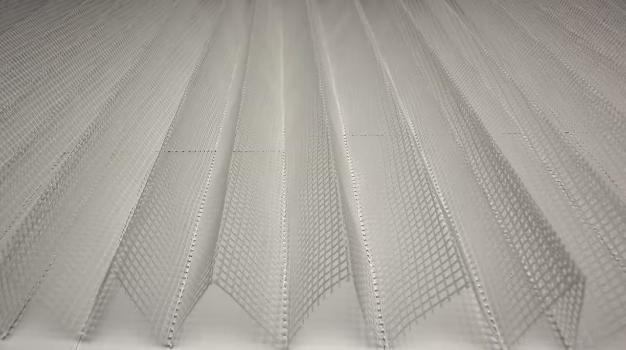 Roman blind raised to show its soft stacked folds