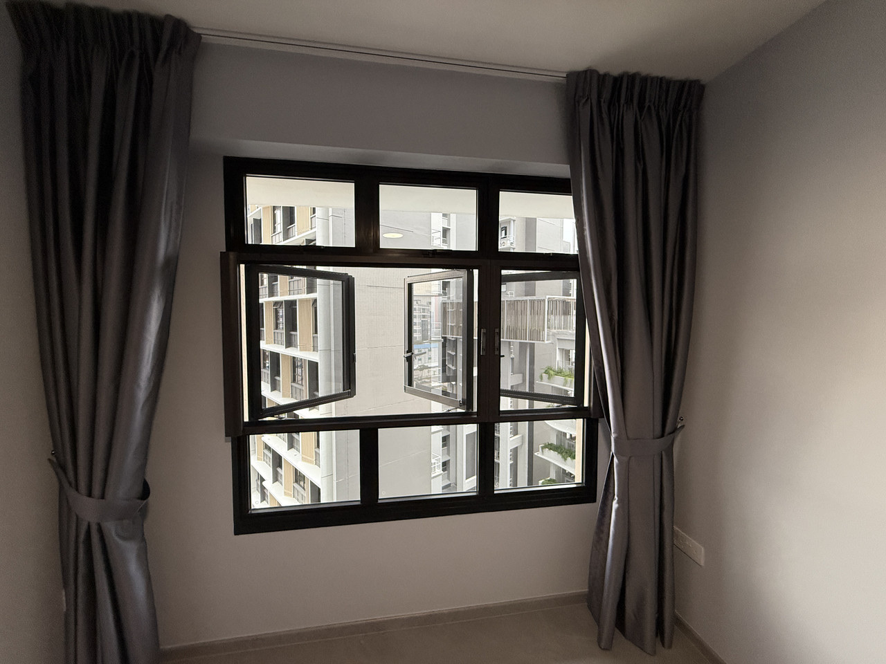 Roman blinds across a wide window span