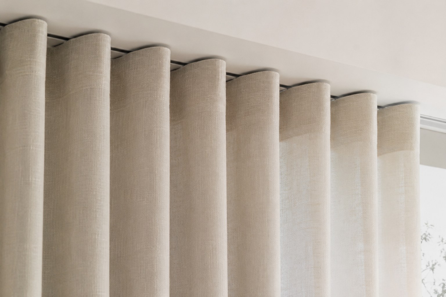 Ripple-fold curtains falling in one continuous, uniform S-wave