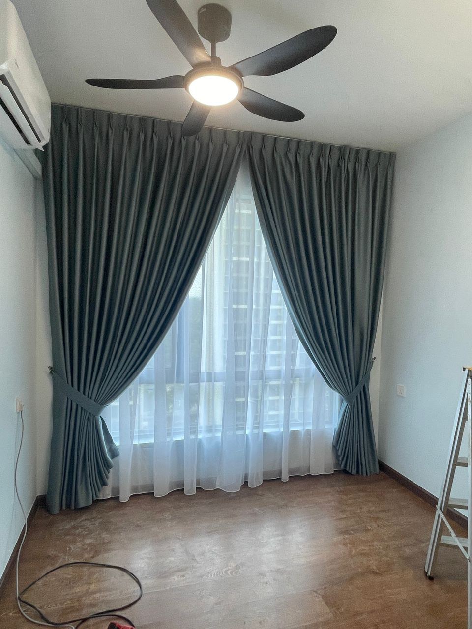 Made-to-measure curtains dressing a living-room window