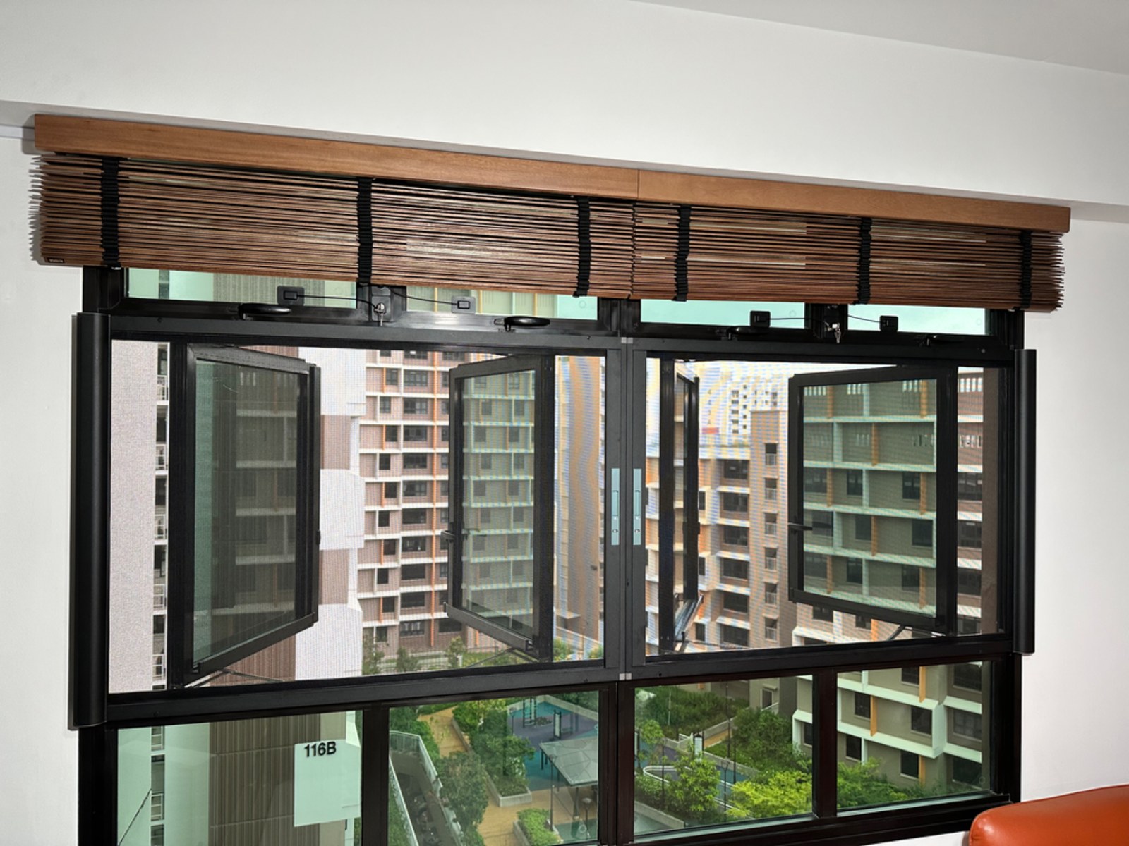 Retractable window mesh fitted to a home window in Singapore